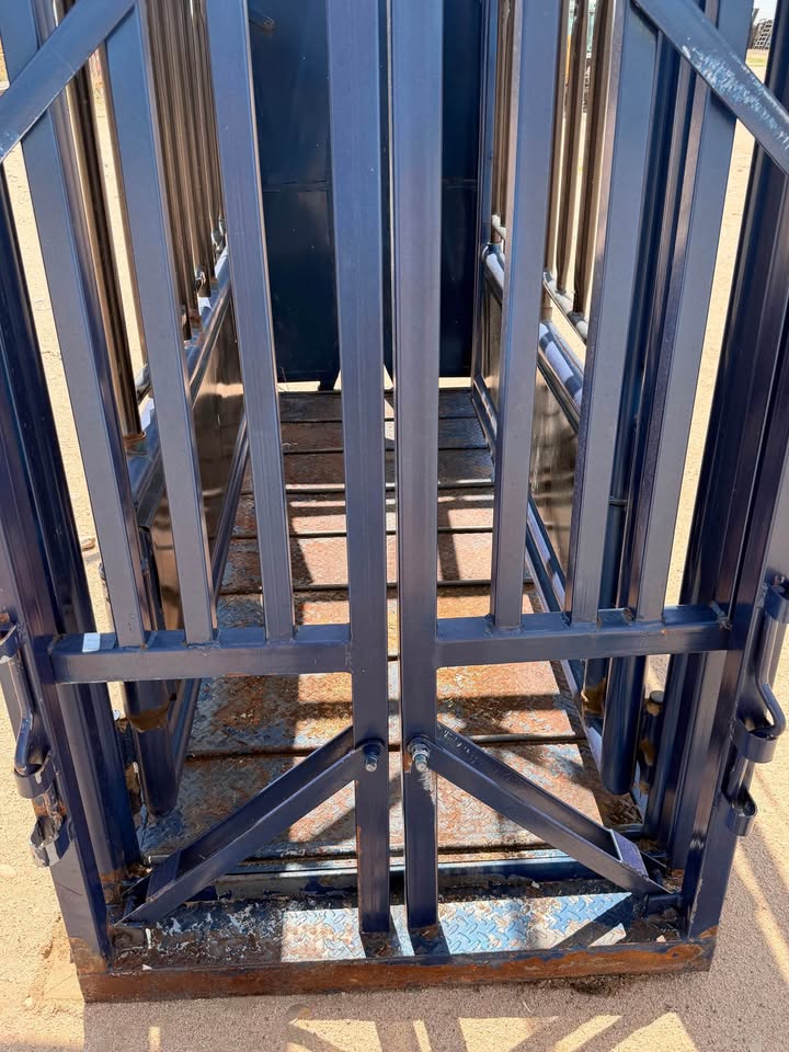 The Flying A Side Exit Cattle Squeeze Chute with Manual Headgate & Split Rear Tailgate